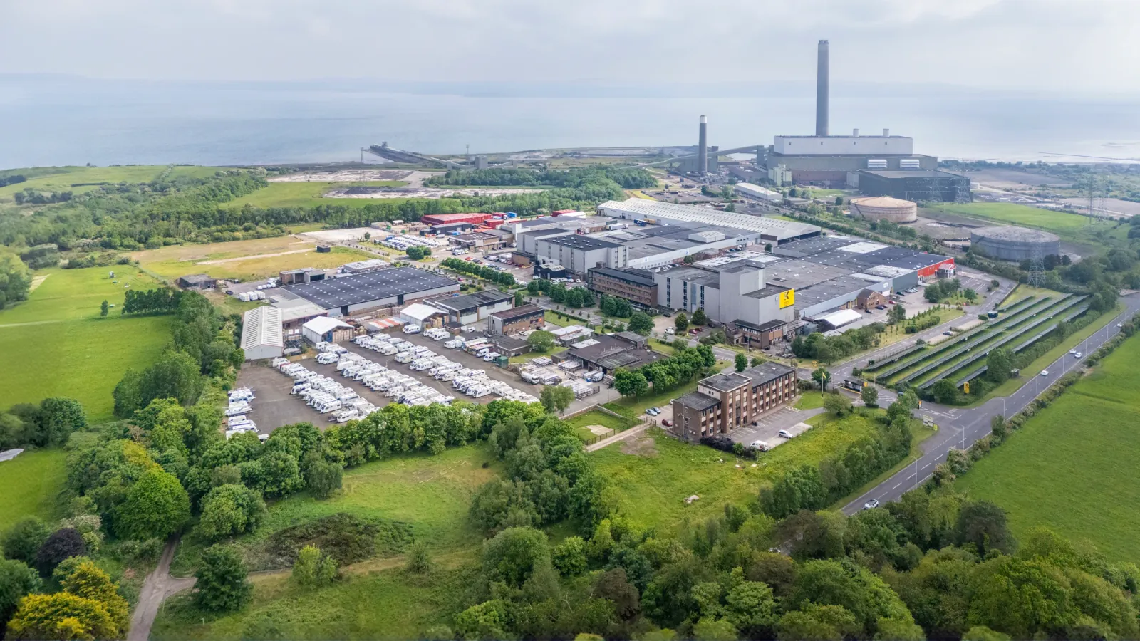 Aerial view of Kilroot Business Park with Kilroot Power Station and Belfast Lough